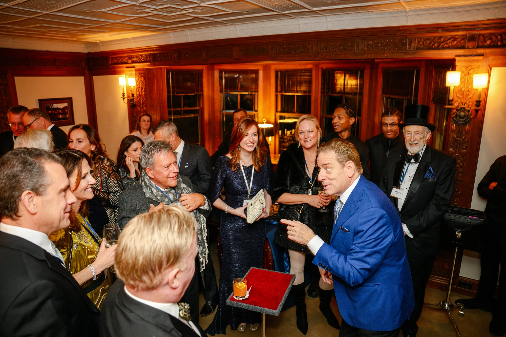 Mike Thornton performing strolling close-up magic for guests at Cranbrook